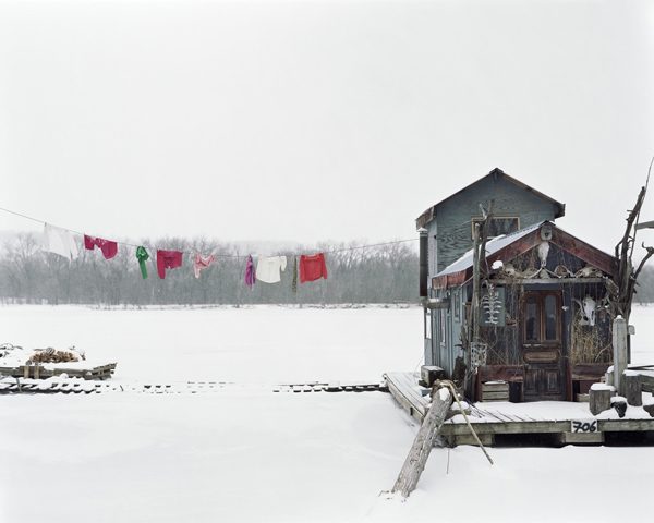 Peter's Houseboat, Alec Soth, photo of blue houseboat and clothesline covered in snow