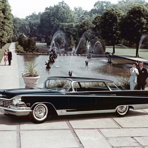 two couples stand next to 1959 Buick Electra 225