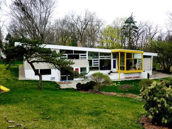 modern building exterior with square windows and yellow accents