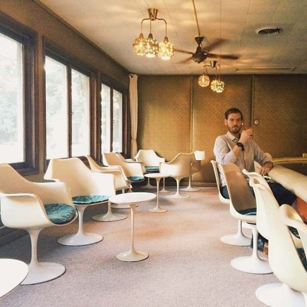 photo of bearded man sitting at a bar