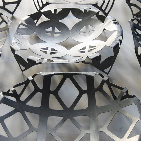 dark metal dishes with geometric designs