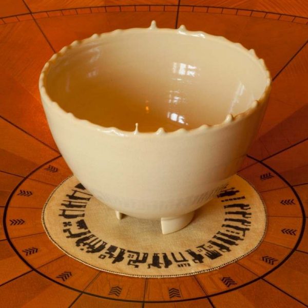 white ceramic bowl on wooden table