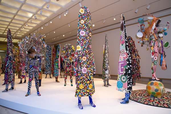 Colorful fabric figures stand on white surface (5)