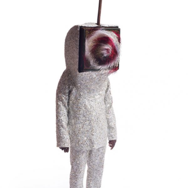 humanoid sculpture with a television for a face