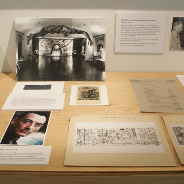 display of sketches and black and white photography