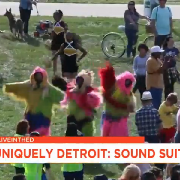 Screenshot of news broadcast covering crowd at Uniquely Detroit