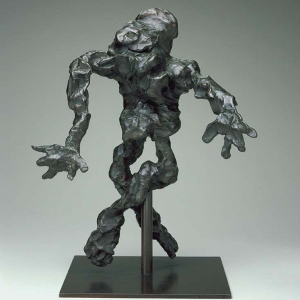 gray sculpture of humanoid figure