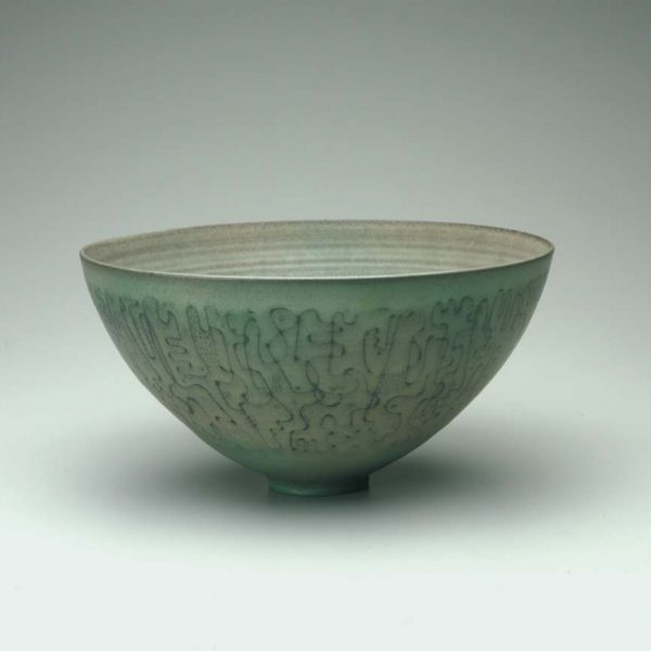 light blue ceramic bowl with swirling line design