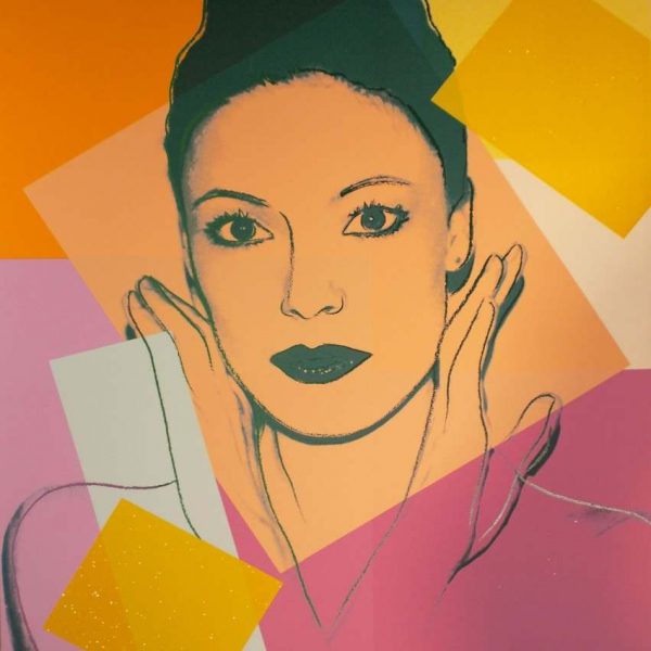 painting of woman's face against colorful squares