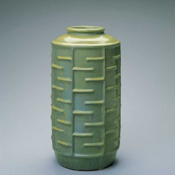 green vase with maze design