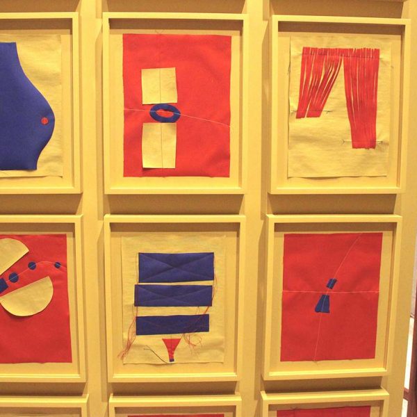 Liz Cohen, weaving in yellow, blue and red fabrics