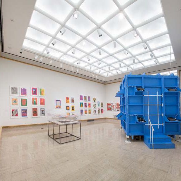 Blue crate sits in white-walled exhibit room