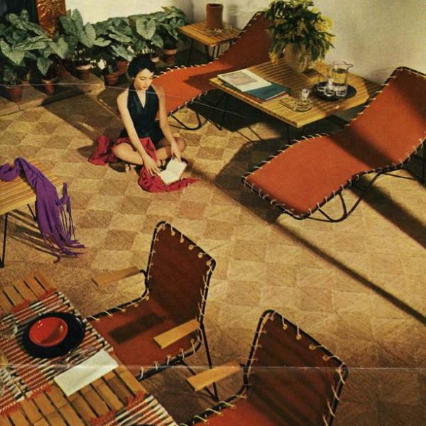 woman in black dress sitting on dining room floor