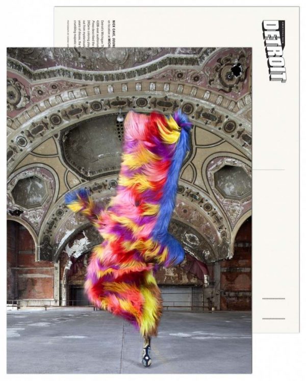 colorful figure in fur stands in front of vintage architecture