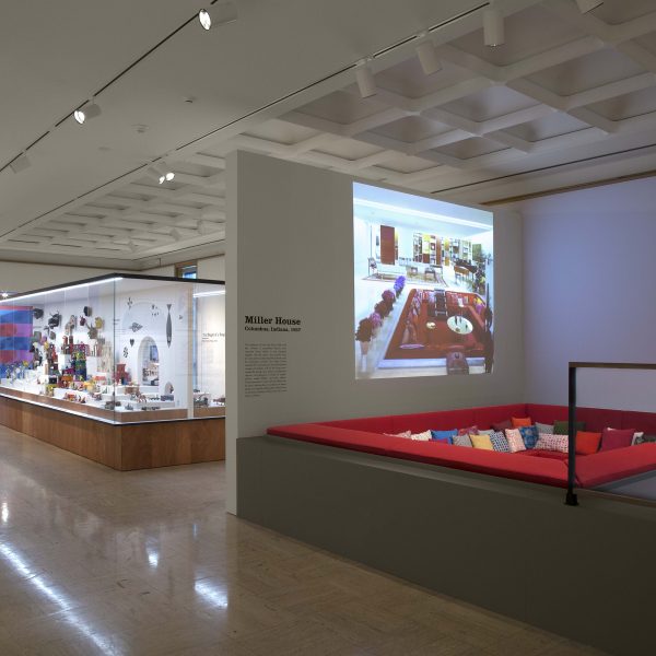 Alexander Girard exhibit hall, red square couch