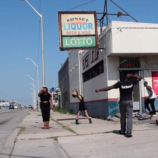 Maya Stovall, people standing in front of sunset liquor store