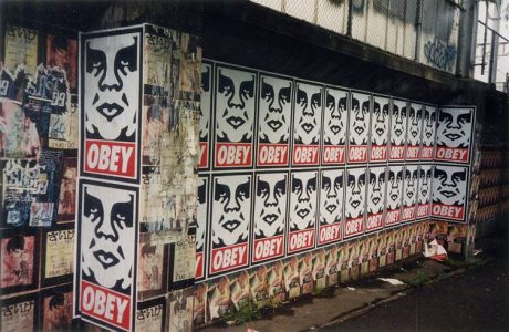 punk Obey signs on outdoor wall