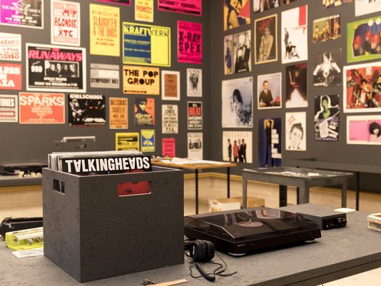 Record player with collection of punk rock vinyls