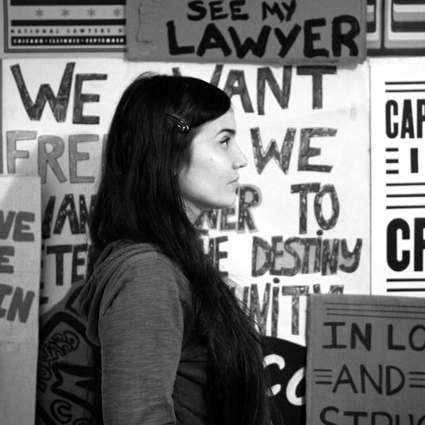 Shanna Merola portrait with protest signs