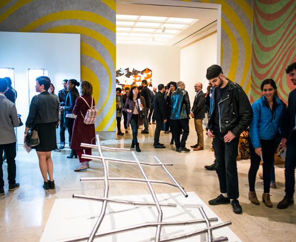 People view pieces at the 2019 Graduate Degree Exhibition