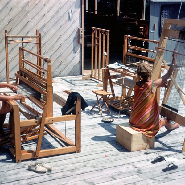 Two women working at looms
