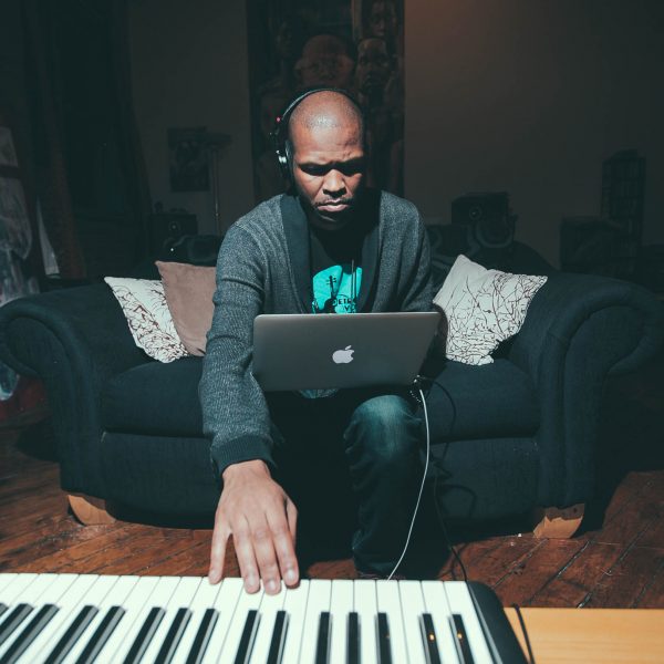Sterling Toles playing using laptop and keyboard