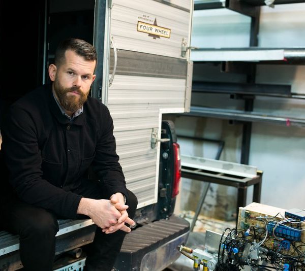 Matthew Day Jackson portrait sitting in a trailer