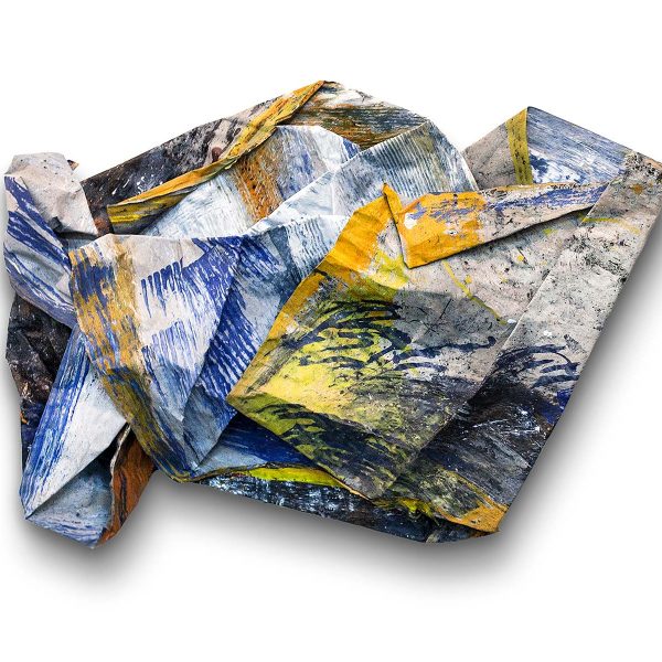 A 3 dimensional painted assemblage by Allie McGhee. The folded material is shaped in a horizontal format in mainle yellow, white, grey, blue, and black.